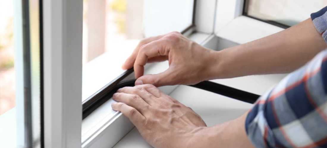 Man insulating windows